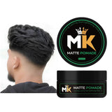 MK Matte Pomade hair product with strong hold next to styled men's haircut