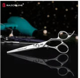 Professional hairdressing scissors with ergonomic handle on salon counter
