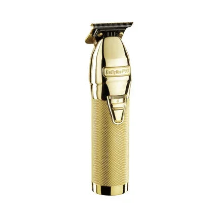 Gold professional hair trimmer with textured handle, ideal for precise beard and hair grooming