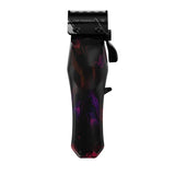 Black and red professional hair clipper with F32 Fadeout blade on white background